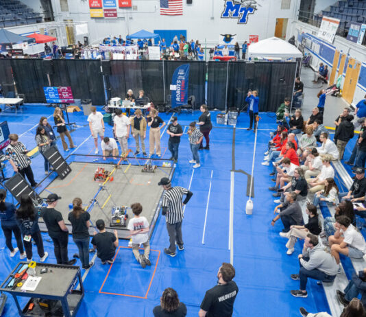 High school teams compete on campus in a robotic battle.